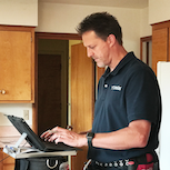 man inspecting house